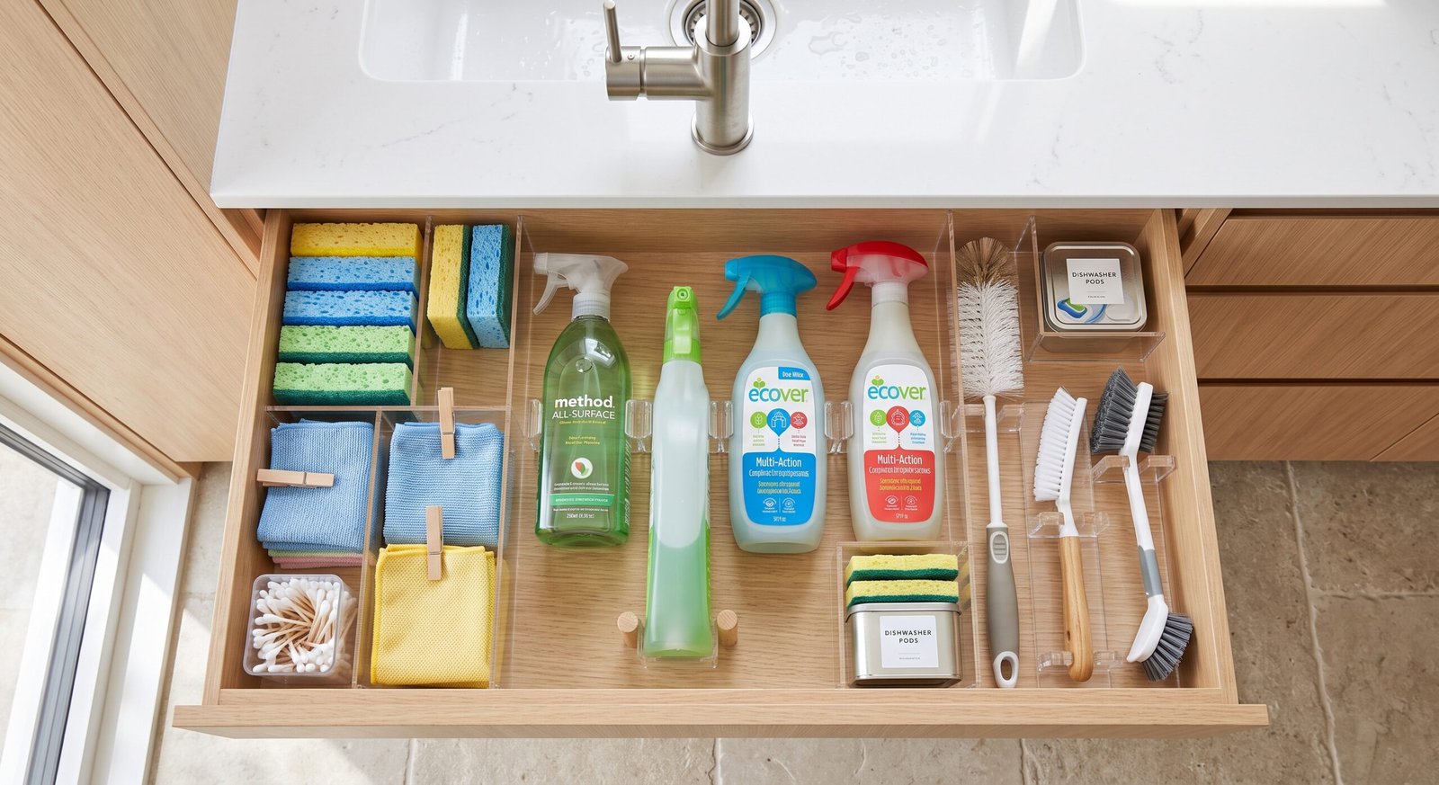 Under-sink pull out cleaning supply drawer organization