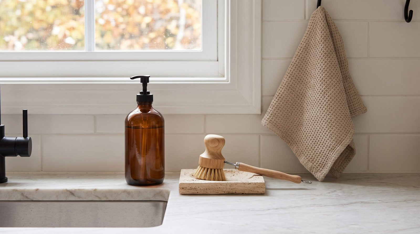 subtle fall kitchen decor ideas with warm neutrals amber glass bottles